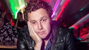 Stockbroker by day, stand up comedian by night. Andrew Wolfe says the two  are surprisingly similar