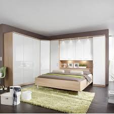 Straight panels are in chipboard, then veneered (veneer being a thin layer of solid wood), then the veneers are lacquered using a 6 steps/layers of uv high gloss polyester lacquer. Modern White High Gloss With Oak Doors White Gloss Bedroom White Gloss Bedroom Furniture Bedroom Furniture Design