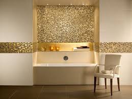 Minimalistic Bathroom In Cream And Gold With A Rectangular Tub And A Chair Glittering Gold Mosaic Beautiful Bathrooms Bathroom Wall Decor Amazing Bathrooms