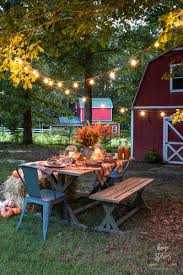 Picnic table in front yard. Fall Plaid Outdoor Harvest Tablescape