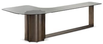 The signature concave curve creates an unique leg style which doubles a magazine storage area. Florio Curved Coffee Table Cantori