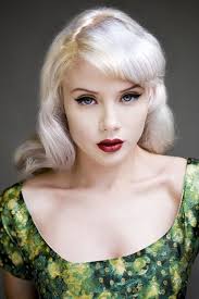 Very Effective With That Platinum Blond Hair Pale Skin Blue Eyes And Red Lips And That Green Dre Blonde Hair Pale Skin Pale Skin Hair Color Hair Pale Skin