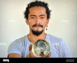 Right hand holds globe hi-res stock photography and images