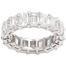 Handmade in 18k white gold, this exceptional shared prong eternity band is set with beautifully matched gia certified 0.70 carat oval diamonds, . 10 Carat Emerald Cut Eternity Band Set In Platinum For Sale At 1stdibs