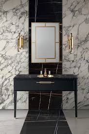 Also consider using materials that aren't pure white, like a marble with interesting veining to soften the space. Marble Bathroom With Gold Fixtures Novocom Top