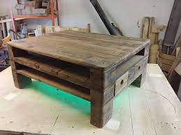 Unusual coffee table with three legs and an oval shape made from shipping pallets, really like this one. Euro Pallet Coffee Table Design 101 Pallets