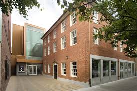 Modern Theater Entrance Set Back From Reconstructed Historic Brick Facade Theater Performancespace Modernarchite Modern Architecture Architect Brick Facade