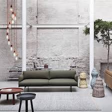 The plywood is heat pressed and molded to the exact curvature. The Around Coffee Table Solid Wood Muuto