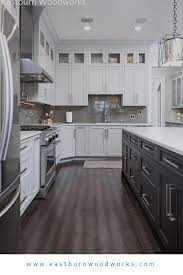 White Kitchen Cabinetry With A Dark Kitchen Island Dark Kitchen White Kitchen Kitchen Design