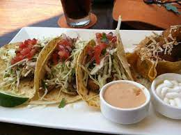 Top the fish with a little of the mixed island slaw. Yummy Fish Tacos One Destined For Take Away Picture Of Tommy Bahama Restaurant Bar Waimea Tripadvisor