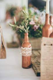 Wine cork bird houses — simon's granddaughter. Rustic Copper Sprayed Wine Bottles For Table Decor Made Feminine With Sime Lace And Olive Rustic Wedding Centerpieces Rustic Wedding Decor Rustic Wedding Diy