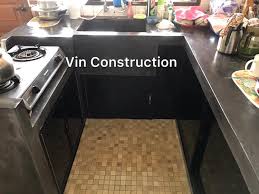 It looks like a plastic table with a concrete colored sticker on top and one around the edges. Concrete Kitchen Table Top Black Vin Construction Facebook