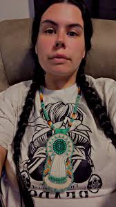 Beaded medallion with dentalium shells and deerhide ties