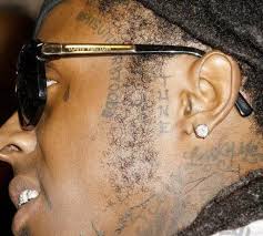 The tattoo represents belfast street which is located lil wayne has the word baby tattoos on his right shoulder to represent his love and respect for his father, mentor, and cash money records founder. Ultimate Lil Wayne Tattoo Guide All Tattoos Meanings