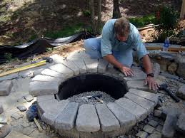 Now start placing the concrete blocks or cinder blocks around the perimeter of the pit. How To Build A Round Stone Fire Pit How Tos Diy