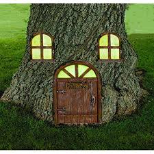 Fairy garden ideas you make yourself! Amazon Com Large Garden Fairy Hobbit Door Ideal For Gardens And Bottom Of Trees By Penfound Home Kitchen
