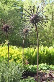 2.or you can also find them on a garden border. These Metal Dandelions Are Awesome Garden Art Diy Garden Art Metal Garden Art