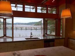 Narrow, continuous, horizontal rails create streamlined appearance. 15 Gorgeous Glass Wall Systems Folding Glass Doors And Sliding Glass Doors Hgtv