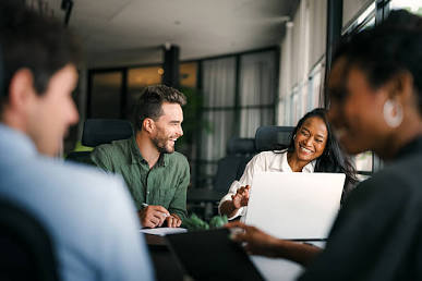 The VEOM Technologies team collaborating, AI generated