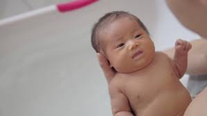 Now, wash your face and neck with cold water. Portrait Of Asian Newborn Baby Stock Footage Video 100 Royalty Free 1030724594 Shutterstock