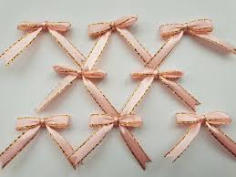 Gently bend the stick into a bow shape, tie the other end of the floss, around the other end of the stick, sitting in the slits. Paper Gift Wrapping 50100 Light Pink Ribbon Bows With Gold Detail Applique Embellishments Wedding Decoration Baby Shower Card Making Scrapbooking Small Bows