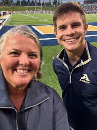 Made some new friends at the game tonight! Thank you for working together  to deliver an excellent game day experience under the lights!  #akronathletics #akronbands #zips