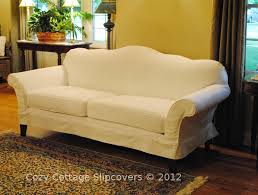 It's amazing how a simple, canvas slipcover can instantly update an old piece of furniture. Cozy Cottage Slipcovers Camel Back Sofa