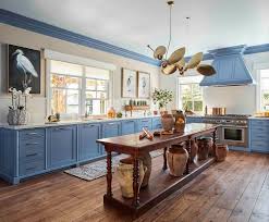 Super smooth surfaces run from walls to cabinets to countertops and the texture even flows to the clear plastic stool tops. How To Design Your Kitchen One Kings Lane Blog
