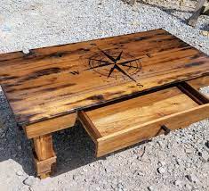 Diy distressed wood table best image from s s media cache ak0, source: Diy Reclaimed Wood Coffee Table With Compass Burned On Top Kitchen Table Wood Burnt Coffee Table Diy Kitchen Table
