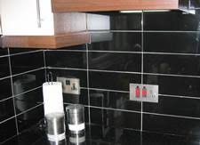 Adding vinyl, white stone, marble, or ceramic tiles to your kitchen backsplash, shower, or floors can also protect surfaces from water and debris. Kitchen Tiles Azulejo Nero Brillo Wall Tile Black Gloss Ceramic