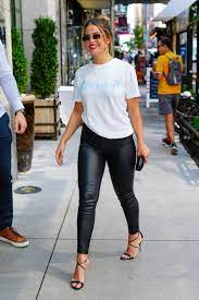 Addison Rae rocks black leather pants and a white tee while out and about  in New