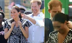 Prince harry and meghan have celebrated the new year with an adorable photo of baby archie having a cuddle with his dad. Adorable Moment Prince Harry Affectionately Strokes Meghan Markle S Ponytail Daily Mail Online