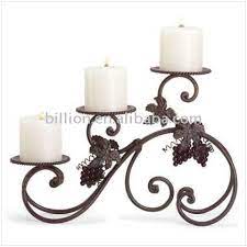 Stunning and one of a king wrought iron candelabra that holds 12 candles.the piece has beautiful lines and seats on a tripod. Decorative Wrought Iron Candle Holders Iron Candle Holders Candlestick Buy Wrought Iron Candle Holders Wrought Iron Candle Holders Wrought Iron Candle Holders Product On Alibaba Com