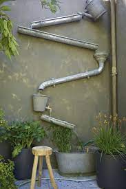 Creative And Artistic Way To Use Water Drain Pipes To Catch Store Rain Water Diy Water Feature Upcycle Garden Garden Inspiration