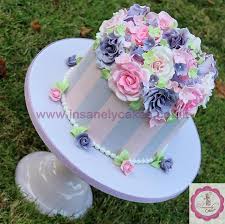 Our signature floral birthday cake may look good enough to eat, but it's actually crafted from fresh pastel flowers such as mini carnations and poms. Pretty Pastel Pink N Purple Vintage Floral Celebration Cakesdecor