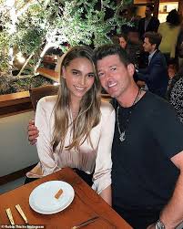 There is also a remix for the song, that does not only feature robin thicke and pharrell but also two verses by rapper busta rhymes. Robin Thicke Shows Off His Unique New Haircut On Social Media As April Love Geary Responds Daily Mail Online