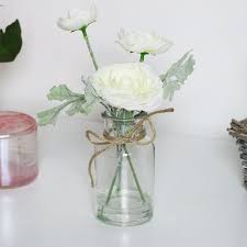 Faux white flowers in vase. Faux White Flowers In Glass Jar