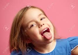 It can be an act of rudeness, disgust, playfulness, or outright sexual provocation. Close Up Shot Of Little Girl With Her Tongue Out Over Pink Isolated Stock Photo Picture And Royalty Free Image Image 116771421