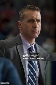 Jameson Murray of the Calgary Hitmen skates to the bench against the...  News Photo