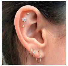 Flat Piercing Ideas Ear Curation On Instagram Threes The Lucky Number Triple Flat Piercings And In 2021 Pretty Ear Piercings Three Ear Piercings Cute Ear Piercings