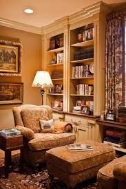 Ottoman Between 2 Chairs Facing Each Other Surrounded By Books Warm And Cozy Home House Interior Home Decor