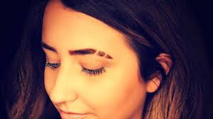 Shaving gaps in your eyebrows to be trendy. Eyebrow Trends And What They Meant