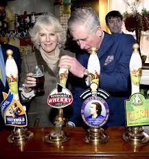 Camilla pour pints at village pub