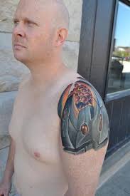 bio-mechanical shoulder by Chuck Day: TattooNOW
