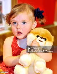 Lily Parker aged 18 months cuddles Boo the World's cutest dog at... News  Photo