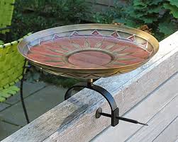 The stand is made from hand forged wrought iron. Achla Red African Daisy Bird Bath With Over Rail Bracket At Bestnest Com