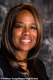 Teachers get in heated feud after one hangs black doll from cord