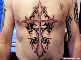 A skull face inside cross tattoo design its a symbol of evilness. Cross Tattoo Design On Chest