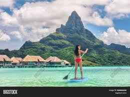 Landscape of tropical island beach with perfect sky, palms, traditional buildings. Tahiti Bora Bora Image Photo Free Trial Bigstock