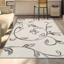 This area rug is colorfast, cleans easily, and is stain resistant. Miranda Haus Vine Modern Scroll Indoor Area Rug Collection